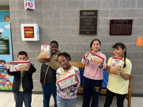 A group of children holding boxesAI-generated content may be incorrect.