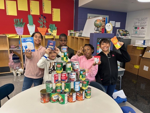 A group of people posing for a pictureAI-generated content may be incorrect.