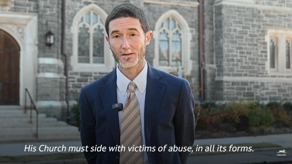 A person in a suit and tieAI-generated content may be incorrect.