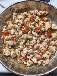 A pan of food with spicesAI-generated content may be incorrect.