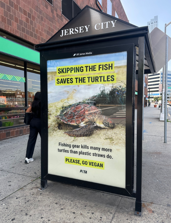 A sign on the sidewalkAI-generated content may be incorrect.