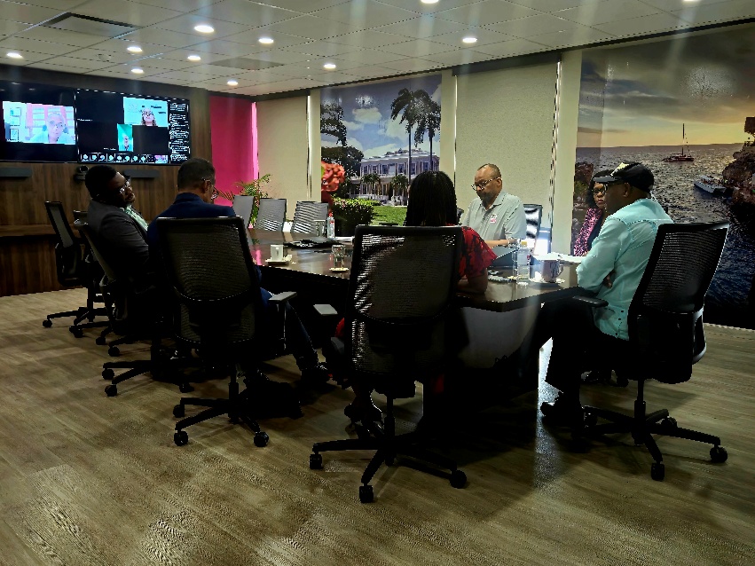 A group of people sitting around a tableAI-generated content may be incorrect.