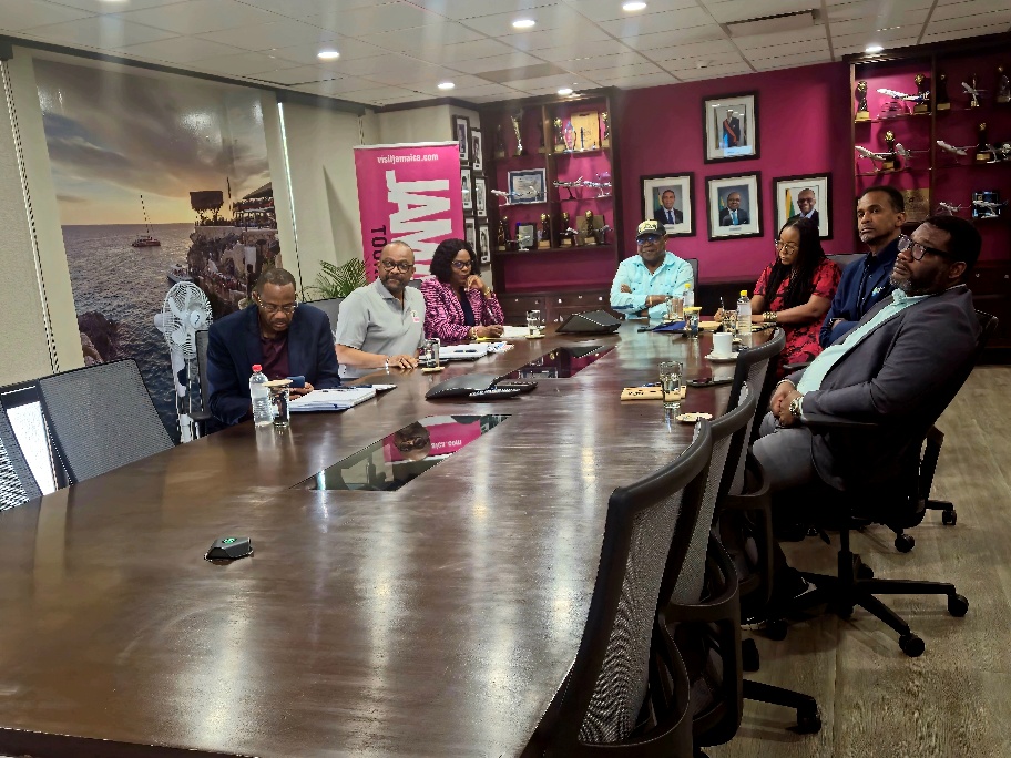 A group of people sitting around a tableAI-generated content may be incorrect.