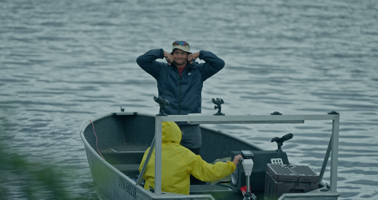 A person in a boat with his hands behind his headAI-generated content may be incorrect.