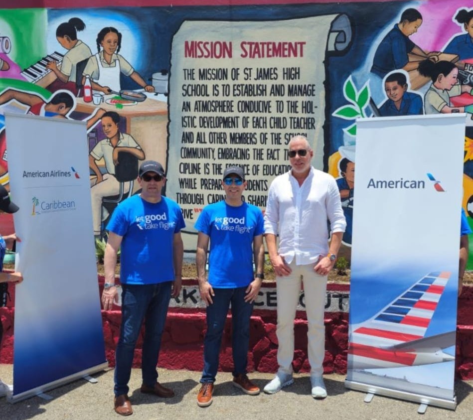 A group of men standing in front of a muralAI-generated content may be incorrect.