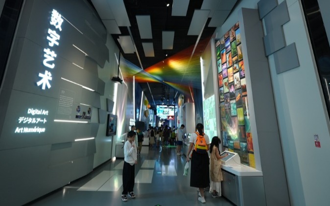 People in a museum looking at a displayAI-generated content may be incorrect.